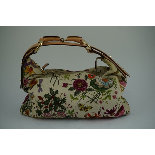 1279 - A Gucci flora canvas horse-bit hobo bag with dust bag