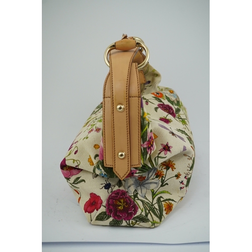 1279 - A Gucci flora canvas horse-bit hobo bag with dust bag