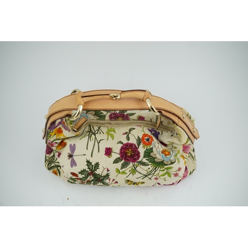 1279 - A Gucci flora canvas horse-bit hobo bag with dust bag