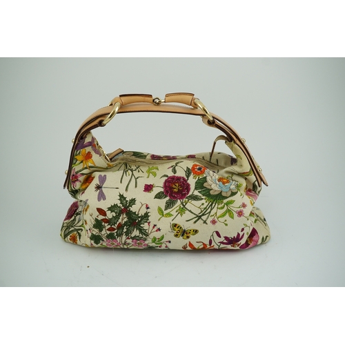 1279 - A Gucci flora canvas horse-bit hobo bag with dust bag