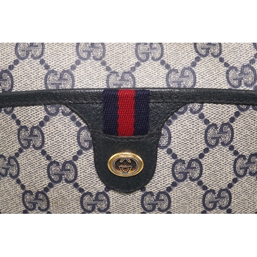 1283 - Three vintage Gucci handbags, two canvas blue GG monogram and the other black leather