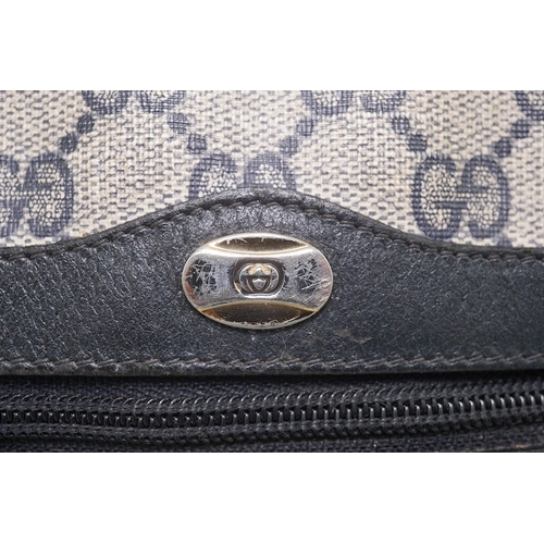 1283 - Three vintage Gucci handbags, two canvas blue GG monogram and the other black leather