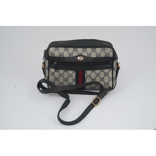 1283 - Three vintage Gucci handbags, two canvas blue GG monogram and the other black leather