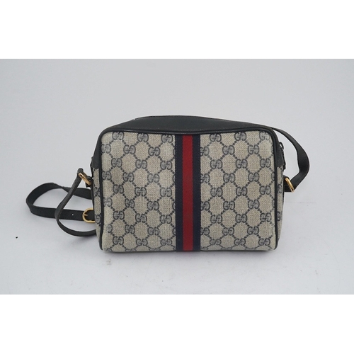 1283 - Three vintage Gucci handbags, two canvas blue GG monogram and the other black leather