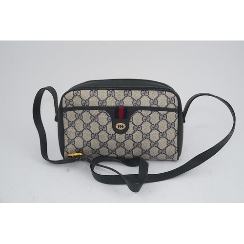 1283 - Three vintage Gucci handbags, two canvas blue GG monogram and the other black leather