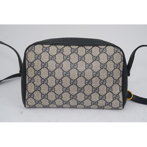 1283 - Three vintage Gucci handbags, two canvas blue GG monogram and the other black leather