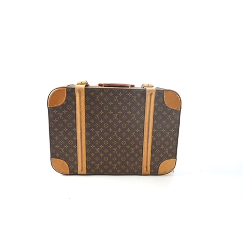 1285 - A Louis Vuitton monogrammed canvas with leather trim soft sided suitcase