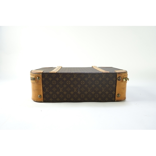 1285 - A Louis Vuitton monogrammed canvas with leather trim soft sided suitcase