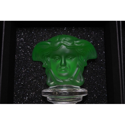 1291 - Six boxed Rosenthal for Versace glass Medusa head wine bottle stoppers in various colours and a boxe... 