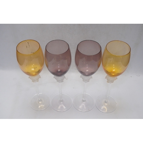 1297 - Four boxed Rosenthal for Versace Medusa head wine glasses in various colours, 26cm high. Condition -... 