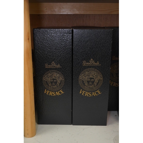 1297 - Four boxed Rosenthal for Versace Medusa head wine glasses in various colours, 26cm high. Condition -... 