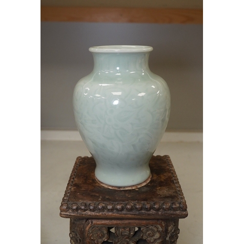 1311 - A Chinese celadon glazed vase, marble inset hardwood stand, 18th century Chinese Export blue and whi... 