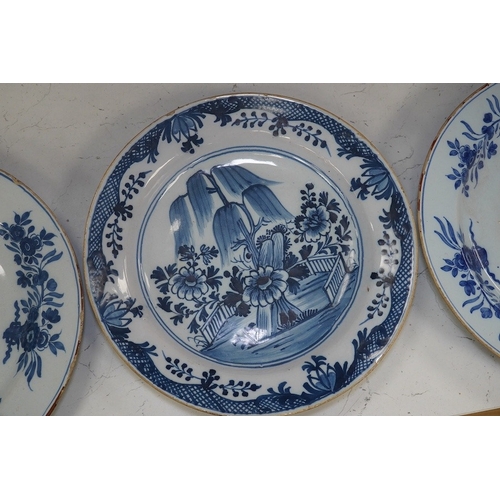 1312 - Three 18th century Delft pottery dishes, largest 31cm diameter. Condition - poor to fair