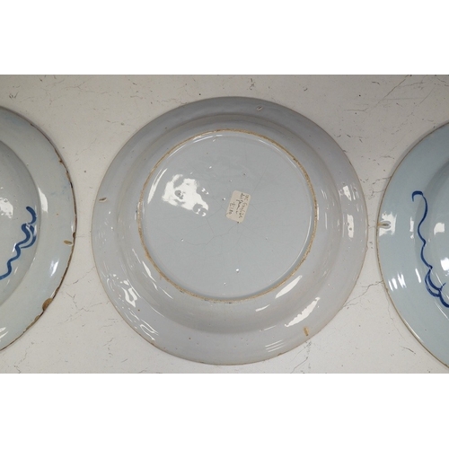 1312 - Three 18th century Delft pottery dishes, largest 31cm diameter. Condition - poor to fair