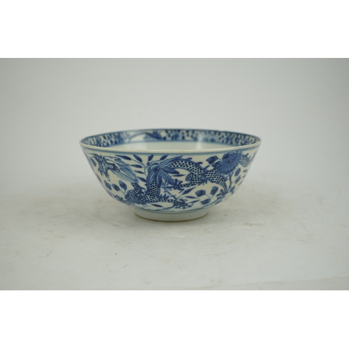 1321 - A Chinese blue and white footed bowl, 19th century, the interior decorated with a bird and flowers, ... 