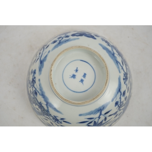 1321 - A Chinese blue and white footed bowl, 19th century, the interior decorated with a bird and flowers, ... 