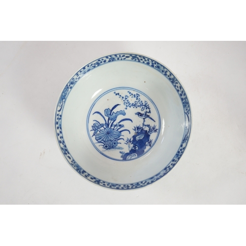 1321 - A Chinese blue and white footed bowl, 19th century, the interior decorated with a bird and flowers, ... 