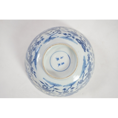 1321 - A Chinese blue and white footed bowl, 19th century, the interior decorated with a bird and flowers, ... 