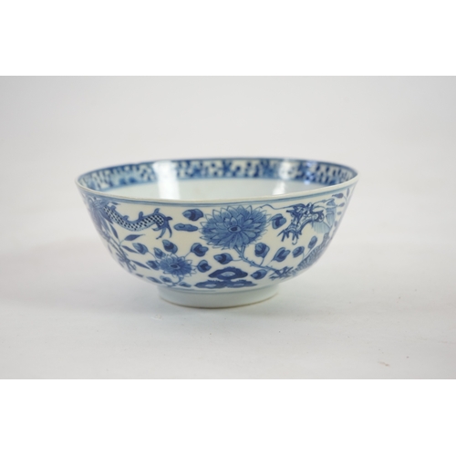 1321 - A Chinese blue and white footed bowl, 19th century, the interior decorated with a bird and flowers, ... 