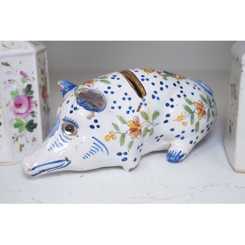 1323 - A faience pig money bank, and two early 19th century painted lidded jars. Condition - poor, damage... 