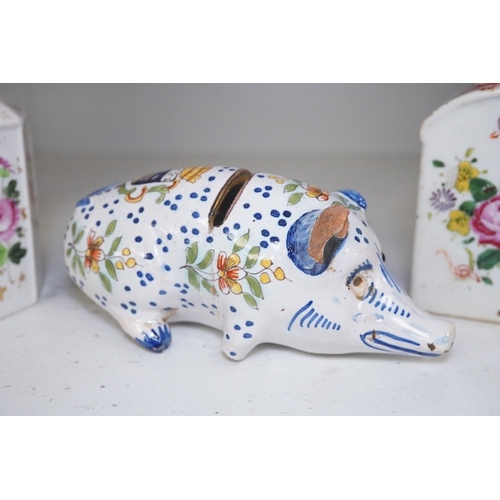 1323 - A faience pig money bank, and two early 19th century painted lidded jars. Condition - poor, damage... 