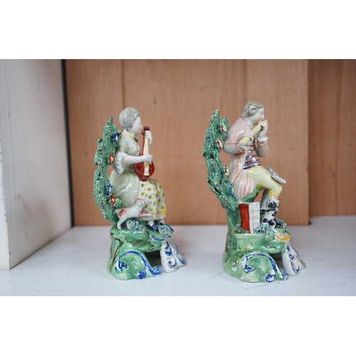 1341 - A pair of early 19th century pearlware groups of seated musicians with dogs, 15.5 cm high, Condition... 