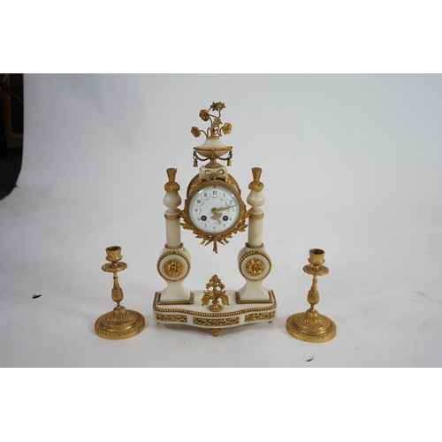 1358 - An early 20th century French ormolu mounted white mounted portico clock with flowering urn surmount ... 