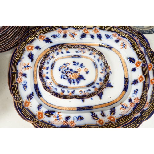 1360 - A Staffordshire flow blue ironstone part dinner service, comprising twenty-two 26.5cm diameter plate... 