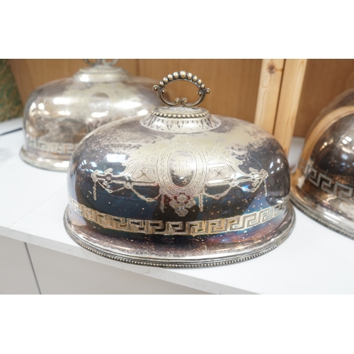 1368 - A set of three graduated Victorian silver plated meat dish covers, 51cm wide. Condition - plate in p... 