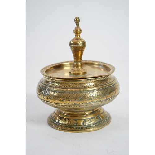 1378 - A 19th century Burmese bronze Offering bowl and cover engraved with scrolling motifs, 26cm high, 19.... 