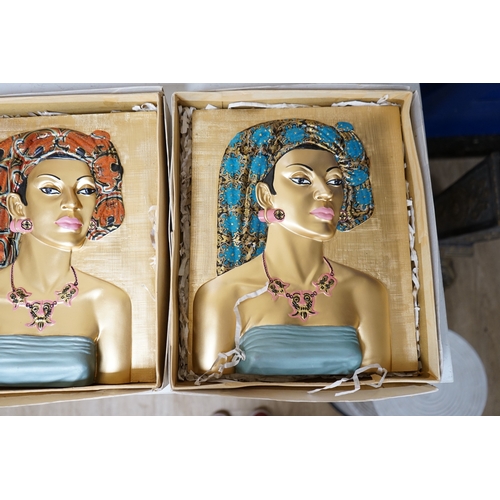 1395 - Five moulded and hand painted plaster plaques, busts of women, in original boxes, 35cm high. Conditi... 