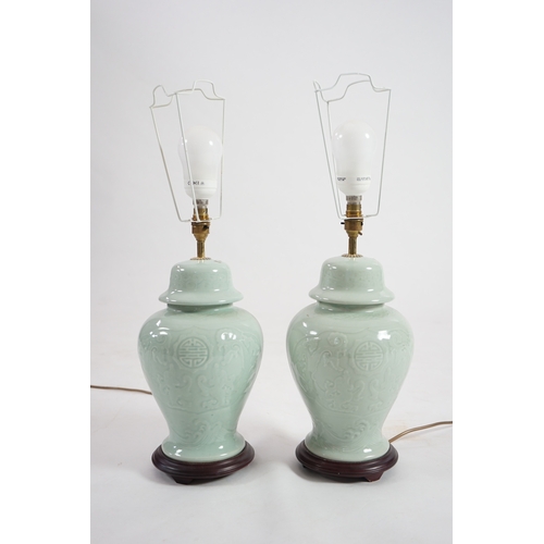 1398 - A pair of modern Chinese celadon glazed table lamps with integral hardwood bases, 36cm high. Conditi... 