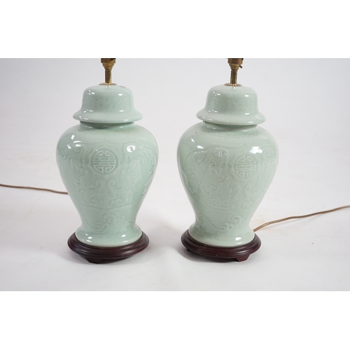 1398 - A pair of modern Chinese celadon glazed table lamps with integral hardwood bases, 36cm high. Conditi... 