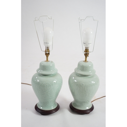 1398 - A pair of modern Chinese celadon glazed table lamps with integral hardwood bases, 36cm high. Conditi... 