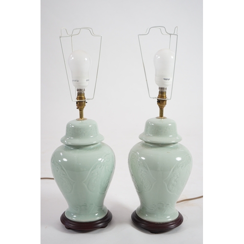 1398 - A pair of modern Chinese celadon glazed table lamps with integral hardwood bases, 36cm high. Conditi... 