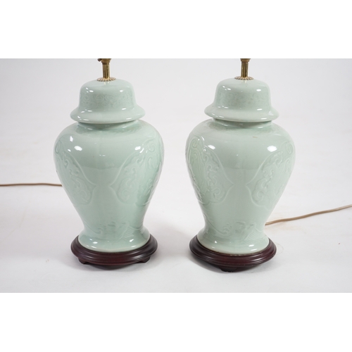 1398 - A pair of modern Chinese celadon glazed table lamps with integral hardwood bases, 36cm high. Conditi... 