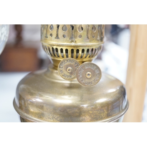 1401 - A late 19th century brass oil lamp with painted bowl and opaque shade together with a later oil lamp... 