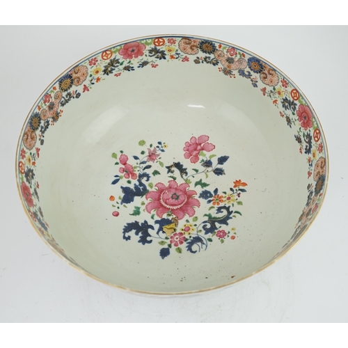 1402 - A large Chinese famille rose punch bowl, Qianlong period, the exterior painted with flowers in a fen... 