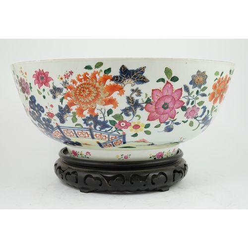 1402 - A large Chinese famille rose punch bowl, Qianlong period, the exterior painted with flowers in a fen... 