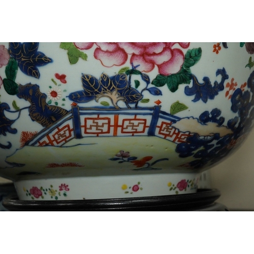 1402 - A large Chinese famille rose punch bowl, Qianlong period, the exterior painted with flowers in a fen... 