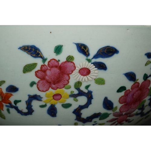 1402 - A large Chinese famille rose punch bowl, Qianlong period, the exterior painted with flowers in a fen... 