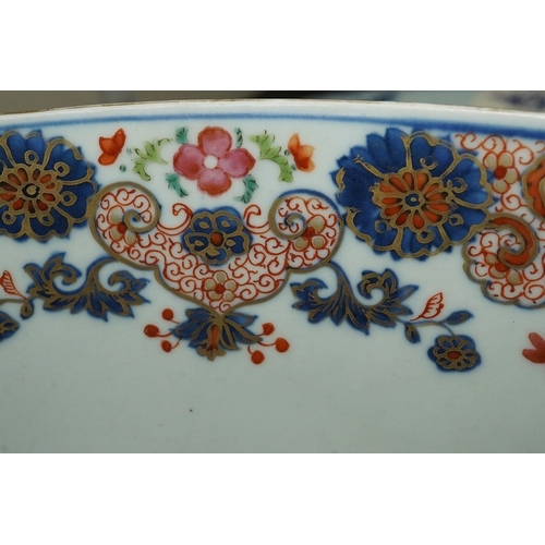 1402 - A large Chinese famille rose punch bowl, Qianlong period, the exterior painted with flowers in a fen... 