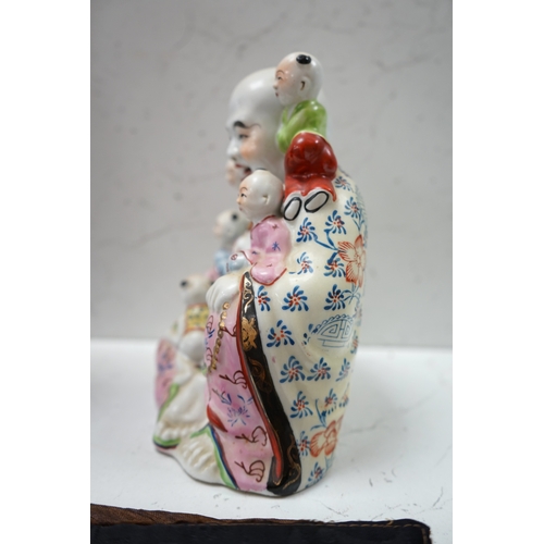 1406 - A Chinese enamelled porcelain Budai group, 20cm. Condition - good