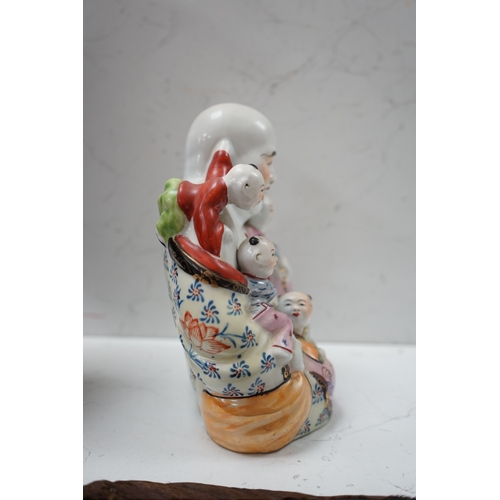 1406 - A Chinese enamelled porcelain Budai group, 20cm. Condition - good