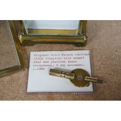 1421 - A late 19th century French brass cased eight day carriage timepiece with key, 14cm high. Condition -... 