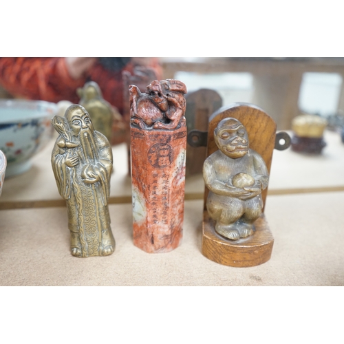 1444 - Five Chinese soapstone seals, a bronze figure of a Shou Lao, a pottery dog, a carved soapstone monke... 