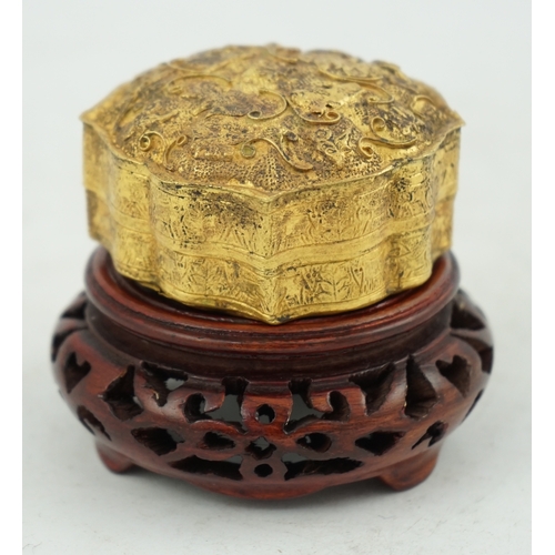 1445 - 'An 18th century Chinese gilt repousee box & cover, probable Liao Dynasty', of petal lobed form, dec... 