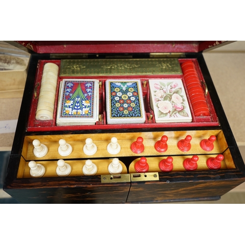 1449 - A Victorian coromandel games box with accessories, ivory chess pieces and counters, box 36cm wide x ... 