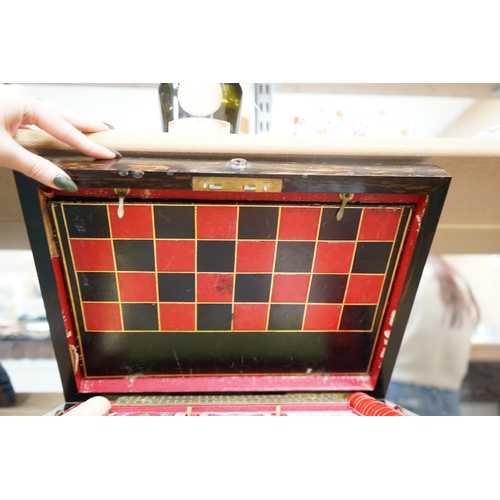 1449 - A Victorian coromandel games box with accessories, ivory chess pieces and counters, box 36cm wide x ... 