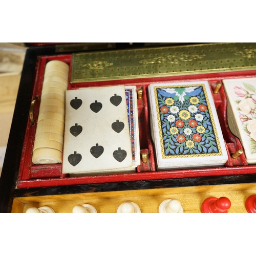 1449 - A Victorian coromandel games box with accessories, ivory chess pieces and counters, box 36cm wide x ... 